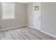 Bright bedroom with a window and wood-look flooring at 929 Olin Ave, Indianapolis, IN 46222