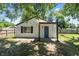 Charming white house with a blue door and covered porch at 929 Olin Ave, Indianapolis, IN 46222