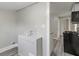 Simple laundry area with hookups and access to the kitchen at 929 Olin Ave, Indianapolis, IN 46222