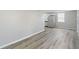 Spacious living room with wood-look flooring and kitchen view at 929 Olin Ave, Indianapolis, IN 46222
