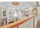 Second floor with elegant chandelier and balcony overlooking living room at 8292 S State Road 39 S Rd, Clayton, IN 46118