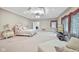 Large bedroom with beige carpet and seating area at 8292 S State Road 39 S Rd, Clayton, IN 46118