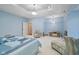 Bedroom with light blue walls, white bed and seating at 8292 S State Road 39 S Rd, Clayton, IN 46118