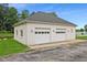 Attached two-car garage with white doors at 8292 S State Road 39 S Rd, Clayton, IN 46118