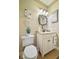 Charming bathroom with white vanity, decorative mirror, and lovely artwork at 8292 S State Road 39 S Rd, Clayton, IN 46118