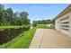 Concrete patio overlooking a pond and trees at 8292 S State Road 39 S Rd, Clayton, IN 46118