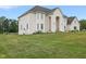 Large white brick house with a spacious lawn and landscaping at 8292 S State Road 39 S Rd, Clayton, IN 46118