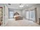 Bright bedroom with carpeted floors and a ceiling fan at 8292 S State Road 39 S Rd, Clayton, IN 46118