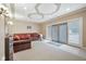 Relaxing basement den with leather sofa and glass-top coffee table at 8292 S State Road 39 S Rd, Clayton, IN 46118