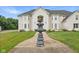 Elegant two-story home with a fountain and landscaped lawn at 8292 S State Road 39 S Rd, Clayton, IN 46118