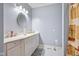 Bathroom with white vanity, shower, and decorative shower curtain at 8292 S State Road 39 S Rd, Clayton, IN 46118
