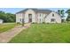 Two-story white brick house with a fountain and landscaped yard at 8292 S State Road 39 S Rd, Clayton, IN 46118