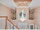 Grand staircase with ornate detailing and views to the foyer and front door at 8292 S State Road 39 S Rd, Clayton, IN 46118