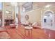 Open living room with hardwood floors, fireplace, and views into the kitchen at 8292 S State Road 39 S Rd, Clayton, IN 46118
