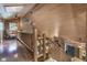 Open upper landing with stone fireplace and log railings at 2705 S 975 E, Zionsville, IN 46077