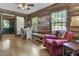 Cozy log cabin office with hardwood floors and a comfortable armchair at 2705 S 975 E, Zionsville, IN 46077