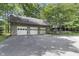 Three-car garage with stone accents and large doors at 2705 S 975 E, Zionsville, IN 46077
