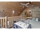 Upstairs hallway with log cabin walls and built-in bookcases at 2705 S 975 E, Zionsville, IN 46077