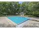 Refreshing in-ground pool with diving board, offering a private oasis at 2705 S 975 E, Zionsville, IN 46077