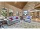 Relaxing sunroom with built in banquette and rocking chair at 2705 S 975 E, Zionsville, IN 46077