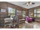 Rustic office featuring log walls, sewing station, and hardwood floors at 2705 S 975 E, Zionsville, IN 46077