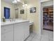 Bright bathroom with white vanity, tiled floor and access to a library at 2705 S 975 E, Zionsville, IN 46077