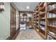 Hallway with built-in bookshelves and wood flooring at 2705 S 975 E, Zionsville, IN 46077