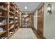 Long hallway with built-in bookcases and access to other rooms at 2705 S 975 E, Zionsville, IN 46077