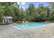 Relaxing in-ground pool with stamped concrete decking and adjacent pool house at 2705 S 975 E, Zionsville, IN 46077