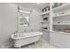 Spa-like bathroom featuring a clawfoot tub and window at 2705 S 975 E, Zionsville, IN 46077