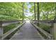 Wooden footbridge through a wooded area at 2705 S 975 E, Zionsville, IN 46077