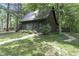 Dark brown guest house with blue door and surrounding lawn at 2705 S 975 E, Zionsville, IN 46077