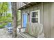 Charming treehouse porch with a wooden swing and blue chairs at 2705 S 975 E, Zionsville, IN 46077