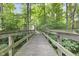 Wooden footbridge leading through a wooded area at 2705 S 975 E, Zionsville, IN 46077