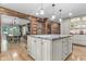 Large kitchen with a granite island, open to the dining room at 2705 S 975 E, Zionsville, IN 46077