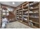 Hallway with built-in bookshelves and wood flooring at 2705 S 975 E, Zionsville, IN 46077