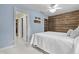 Light blue bedroom with white bedding and access to a bathroom and library at 2705 S 975 E, Zionsville, IN 46077