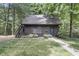 Dark brown guest house with blue door and surrounding lawn at 2705 S 975 E, Zionsville, IN 46077