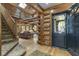 Open entryway with log cabin details and staircase at 2705 S 975 E, Zionsville, IN 46077