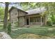 Log home exterior showcasing landscaping and porch at 2705 S 975 E, Zionsville, IN 46077