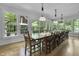 Bright dining room featuring a long wooden table and ample seating at 2705 S 975 E, Zionsville, IN 46077