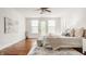 Spacious bedroom with hardwood floors, large windows, and a neutral color scheme at 8235 Ridge Valley Ct, Indianapolis, IN 46278