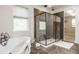 Spa-like bathroom with soaking tub, walk-in shower, and elegant fixtures at 8235 Ridge Valley Ct, Indianapolis, IN 46278
