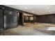 Finished basement with dark walls, concrete floors, and a bar area at 8235 Ridge Valley Ct, Indianapolis, IN 46278