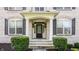 Elegant home entrance with columns and dark door at 8235 Ridge Valley Ct, Indianapolis, IN 46278