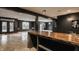 Basement with an open layout, bar, and access to outdoor space at 8235 Ridge Valley Ct, Indianapolis, IN 46278