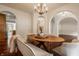 Elegant dining room with wood floors and an oval wooden table at 8235 Ridge Valley Ct, Indianapolis, IN 46278