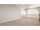 Spacious loft area with carpet and arched openings at 8235 Ridge Valley Ct, Indianapolis, IN 46278