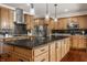 Modern kitchen with island, granite counters and stainless steel appliances at 8235 Ridge Valley Ct, Indianapolis, IN 46278