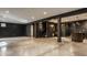 Finished basement showcasing an open layout with dark walls and concrete floors at 8235 Ridge Valley Ct, Indianapolis, IN 46278